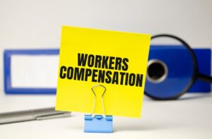 A posted note that says “Workers’ Compensation. Connecticut workers’ comp benefits: what am I entitled to?