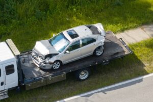 A car being towed after a car accident. How long does a car accident stay on your record in CT?
